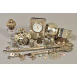 A QUANTITY OF SILVER ITEMS, including two napkin rings, silver handled button hooks, two silver