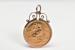 A SOVEREIGN PENDANT, the George V sovereign within a scrolling mount, approximate weight 9.4 grams
