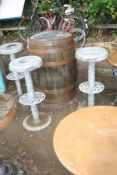 A WHISKEY BARREL GARDEN/BAR TABLE WITH THREE ECCO GALVANISED STOOLS, the whiskey barrel is