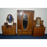 AN EARLY TO MID 20TH CENTURY OAK TWO PIECE BEDROOM SUITE comprising of a mirrored single door