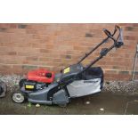 A HONDA HRX 426 PETROL LAWN MOWER with driven roller at rear and brand new grass box