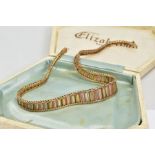 A 9CT GOLD TRI COLOURED BRICK LINK AND HERRINGBONE DESIGN NECKLACE, tapered ends, approximate length