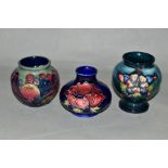 THREE SMALL MOORCROFT POTTERY VASES, 'Finches and Fruit' pattern, height 7.5cm, 'Anemone' pattern on