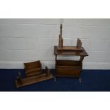 A REPRODUCTION OAK MAGAZINE RACK together with an oak bookstand with a lamp attachment and two other