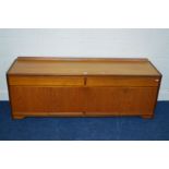 A WILLIAM LAWRENCE LOW TEAK SIDEBOARD with a raised back, two long drawers and four cupboard