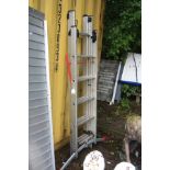 AN ALUMINIUM DOUBLE EXTENSION LADDER with tilt adjustable base and a folding step guard, height