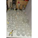 A COLLECTION OF DRINKING GLASSES, VASES, DECANTERS, etc, including tumblers, hock glasses, liqueur