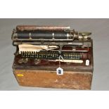 A CASED MERRITT TYPEWRITER, Amercian circa late 19th century, mounted on a wooden base stamped '1234