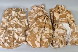 FIVE BRITISH ARMY DESERT CAMO LIGHWEIGHT JACKETS and two pairs of desert camo combat trousers, all
