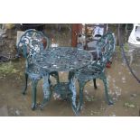 A GREEN CAST ALUMINIUM CIRCULAR GARDEN TABLE, diameter 65cm a pair of matching chairs (sd) and a set