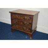 A SMALL MODERN WALNUT CHEST OF THREE DRAWERS on bracket feet, width 53cm x depth 39cm x height