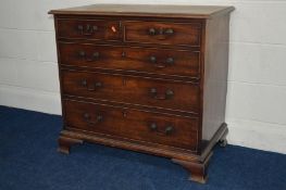 A GEORGE III MAHOGANY CHEST of two short and three long graduating drawers, swan neck handles, brass