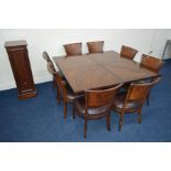 A SQUARE REPRODUCTION FLAME MAHOGANY AND MAHOGANY BANDED FINISH EXTENDING DINING TABLE, extending at