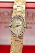A LADIES 9CT GOLD BUECHE GIROD DIAMOND WRISTWATCH, the oval face with black hands and baton markers,