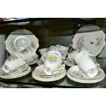 ROYAL ALBERT 'FLOWER OF THE MONTH' TEAWARES comprising of twelve tea cups and saucers, twelve tea