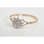 A 9CT GOLD CUBIC ZIRCONIA CLUSTER RING, designed as a cluster of circular colourless cubic