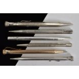 A SELECTION OF SIX RETRACTABLE PENCILS, four designed with engine turned patterns, together with two
