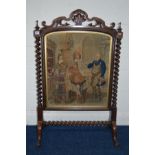 A VICTORIAN ROSEWOOD TAPESTRY FIRESCREEN, the top rail with foliate and scroll detail, twin barley