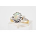 AN 18CT GOLD OPAL AND DIAMOND CLUSTER RING, the central oval opal cabochon within a surround set