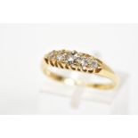 AN EARLY 20TH CENTURY 18CT GOLD FIVE STONE DIAMOND RING, designed as a line of five graduated old