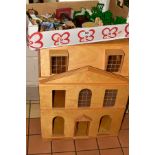 A WOODEN DOLLS HOUSE, modelled as a three story Georgian town house, front opening to reveal six