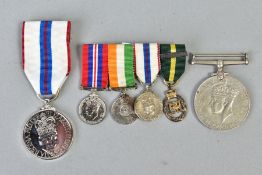 A SMALL NUMBER OF MILITARY MEDALS as follows, four miniature medals on a bar, WWII war medal,