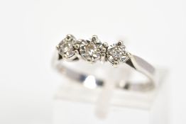 A 9CT WHITE GOLD THREE STONE DIAMOND RING, designed as three brilliant cut diamonds within
