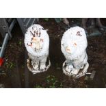AN OPPOSING PAIR OF COMPOSITE GARDEN LION FIGURES on shaped bases, height 52cm