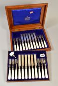 AN OAK CASED EDWARDIAN SET OF SILVER AND MOTHER OF PEARL HANDLED DESSERT KNIVES AND FORKS, makers