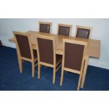 A RECTANGULAR EXTENDING BEECH DINING TABLE with six matching leatherette chairs (7)