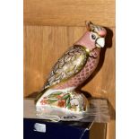 A LIMITED EDITION ROYAL CROWN DERBY PAPERWEIGHT, 'Cockatoo' No611/2500, with certificate and a box