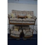 AN ERCOL THREE PIECE LOUNGE SUITE with a medium oak wooden frame, consisting of a three seater sofa,