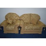 A GOLD UPHOLSTERED TWO PIECE LOUNGE SUITE comprising a two seater settee and an armchair (2)