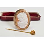 A CAMEO BROOCH AND HAT PIN, the cameo brooch of oval design depicting a lady in profile, with rope