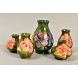 FIVE MOORCROFT VASES, a pair of hibiscus pattern squat vases on a green ground, a pair of bulbous