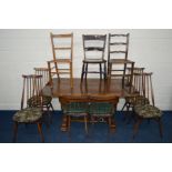 AN EARLY TO MID 20TH CENTURY OAK DRAW LEAF TABLE on an acron base, extended width 150cm x closed