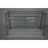 A CASCADE GLASS TABLE TOP DISPLAY CABINET, label reading 'SEAL' brand product to the top, width 76cm