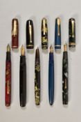 A COLLECTION OF FIVE VINTAGE FOUNTAIN PENS, including a red marbled Canadian Watermans (loose clip),