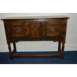 A REPRODUCTION OAK TWO DOOR CABINET, width 107cm x depth 33cm x height 76cm