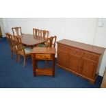 A MODERN YEW WOOD EXTENDING DINING TABLE, width 145cm x depth 94cm with six matching chairs,