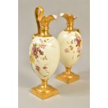 A PAIR OF ROYAL WORCESTER BLUSH IVORY PITCHERS, ref 1144, one having broken handle (not present),