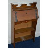 A SLIM OAK ARTS AND CRAFTS BUREAU with open shelves