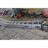 AN ALUMINIUM DOUBLE EXTENSION LADDER, all three sections 240cm long with eight rungs, a Stand off