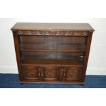 A MODERN OAK OPEN BOOKCASE with triple cupboard doors, width 108cm x depth 32cm x height 97cm