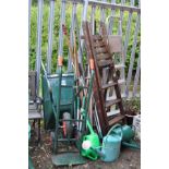 A JEWSON METAL WHEEL BARROW, two step ladders, a sack truck and a quantity of garden tools (15+)