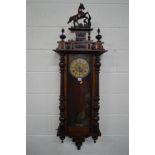 A LATE 19TH CENTURY MAHOGANY AND WALNUT VIENNA REGULATOR WALL CLOCK, with a ceramic horse