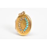AN ANTIQUE OVAL LOCKET, designed with a split pearl and turquoise set wreath to the lid, suspended
