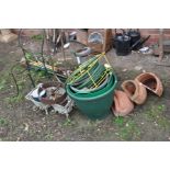 THREE WALL MOUNTED TERRACOTTA PLANTERS, a green house heater, a wire frame chair, various garden