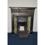 AN EARLY 20TH CENTURY BLACK PAINTED CAST IRON FIRE INSERT, flanked with floral tile inserts, width