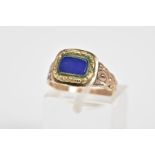 A VICTORIAN MOURNING RING, designed with a square central panel set with a blue panel and engraved